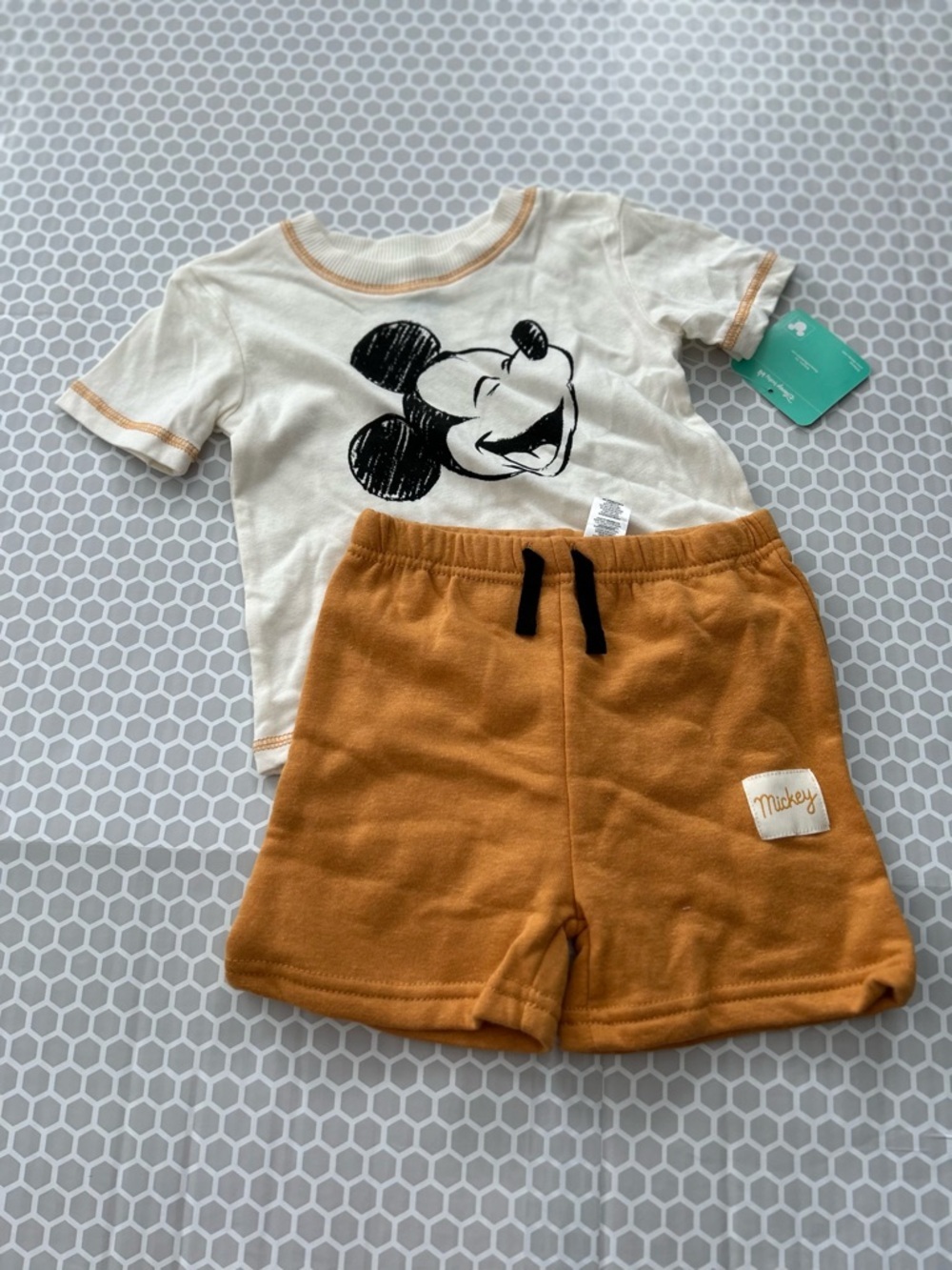 NWT Disney Baby Cream Tee with Tan Contrast Stitching with Mickey Mouse. Size 24